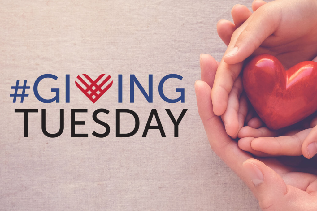 Hands holding a heart regarding Giving Tuesday